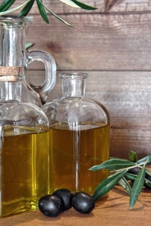 bottled olive oil in small glass jarsの写真素材