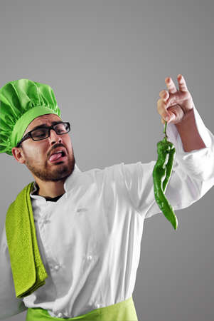 Chef with all his work clothes and cutlery for the kitchenの写真素材