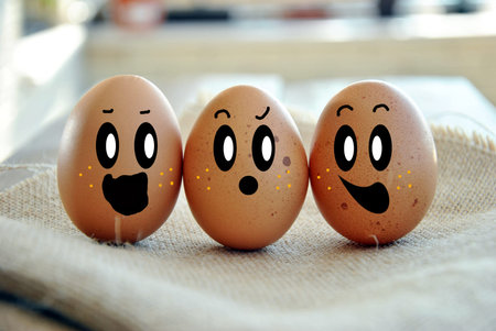 eggs tucked in its box on a wooden tableの写真素材