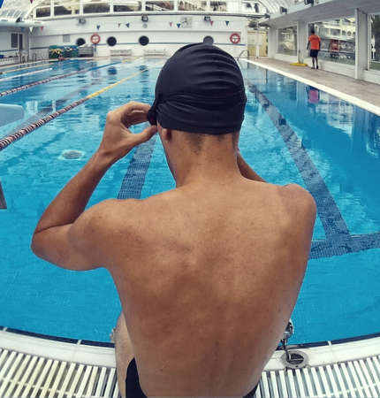 young swimmer in pool swimming in various posturesの写真素材