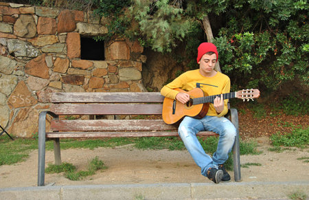 modern musician posing with his Spanish guitar