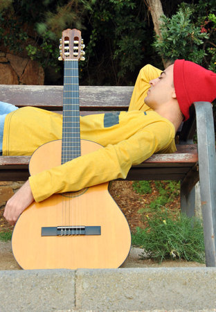modern musician posing with his Spanish guitarの写真素材