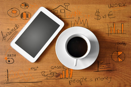 coffee with digital tablet and analytics businessの写真素材