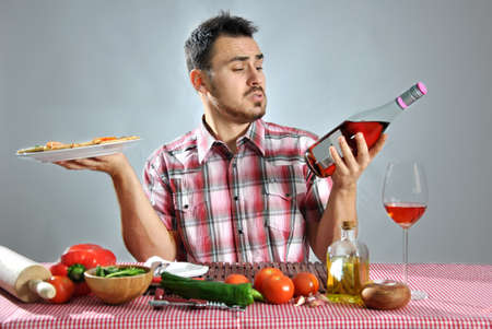 Crazy hungry man eating pizza in a restaurantの写真素材
