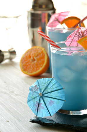 blue lagoon cocktail with ice and glass decorの写真素材