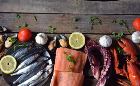 many types of fish on the table. We find lobster, sardines, clams, Octopus, and salmonの写真素材