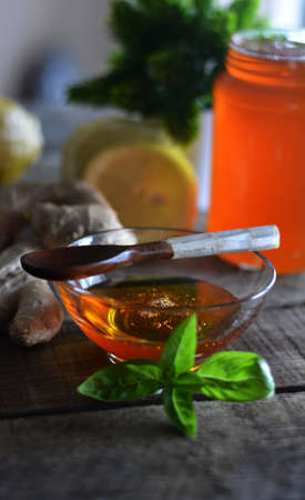 Honey accompanied by Ginger, lemon and teaの写真素材