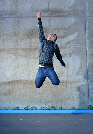 teenage jumping of happiness in the street