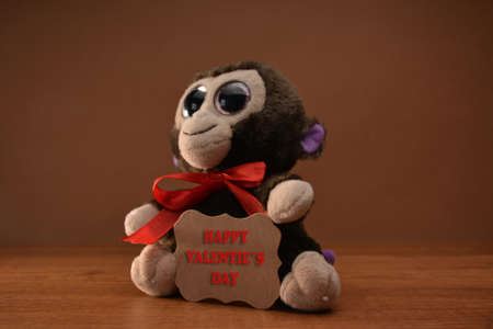 Teddy bear with LOVE wood and a gift for Valentine Day lyricsの写真素材