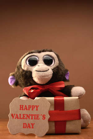Teddy bear with LOVE wood and a gift for Valentine Day lyricsの写真素材