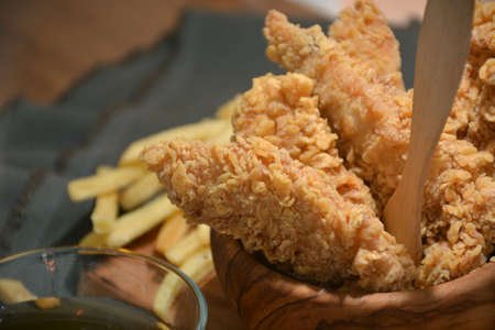 fried chicken platter accompanied by honeyの写真素材