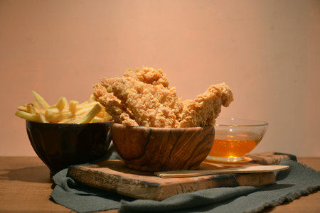  fried chicken platter accompanied by honeyの写真素材