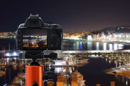 camera taking pictures of landscapes at sunsetの写真素材