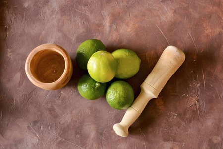 Ingredients for the realization of a mojito. We find limes, mint, rum, sugar and iceの写真素材
