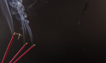 photograph of smoke caused by various incenses on black background