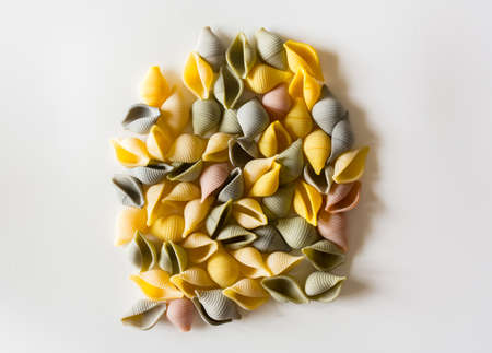 Typical Italian conchiglie pasta accompanied by macaroonsの写真素材