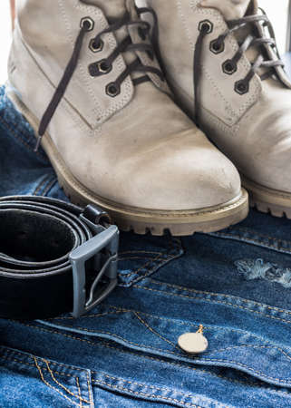 Jeans menswear along with boots and beltの写真素材