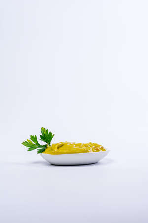 Plate full of nachos with guacamole on a white backgroundの写真素材