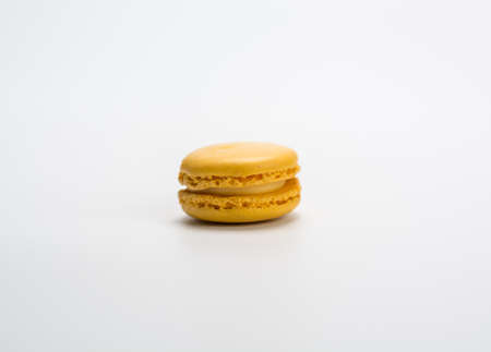 several small macarons of different flavors on a white backgroundの写真素材