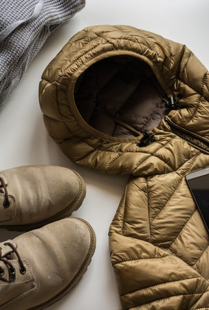 Winter clothing for man, composed of jacket, boots and Sweatshirt