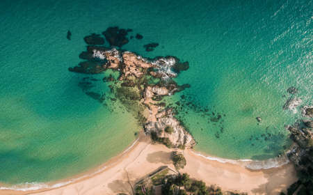 Aerial views of the rocks in the sea on a sunny day in the Costa Brava in Spainの写真素材
