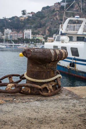 Photograph of a fishing port on a cloudy day. The port is located in Blanes, Spainの写真素材