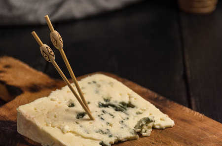 Portion of cheese roquefort at a table rustic. Blue Cheese's flavor, perfect for making sauces