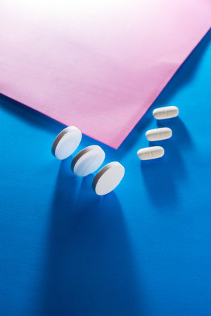 Several types of pills, such as antibiotics, anti-inflammatories. All on blue background