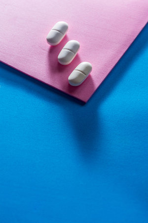Several types of pills, such as antibiotics, anti-inflammatories. All on blue background