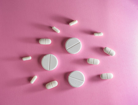 Several types of pills, such as antibiotics, anti-inflammatories. All on blue background