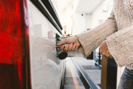 Ecological car that runs on natural gas. Hose to refuel the ecological vehicleの写真素材