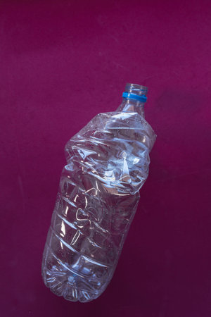 Several plastic bottles ready to be recycled in a trash bin