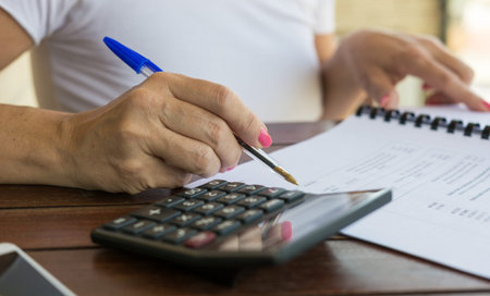 woman doing number counting with the calculator