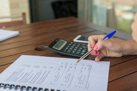 woman doing number counting with the calculator