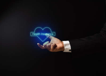 man's hand with conceptual design on medicine and health insuranceの写真素材