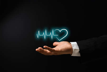 man's hand with conceptual design on medicine and health insuranceの写真素材