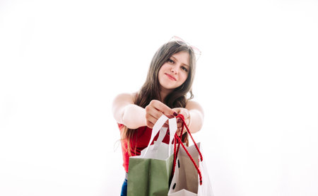 Girl giving you a bag with gifts to celebrate valentine's day.