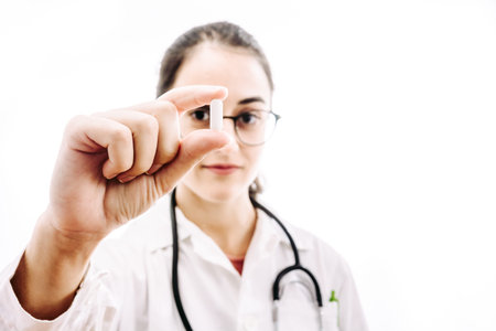 Doctor prescribing a headache medication. Photography on white background