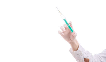 Doctor with injection in hand ready to give a vaccineの写真素材