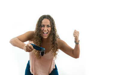 Group of friends playing video games and putting expressions of various emotionsの写真素材