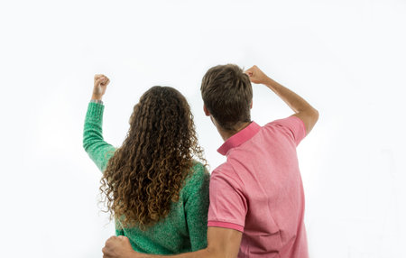 Couple of lovers, back hugged looking at the horizon