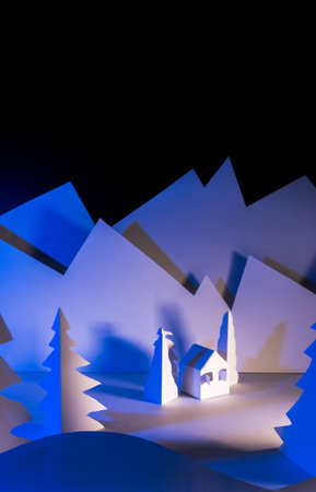 Snowy landscape of high mountain with white pines, and house in the middle of the landscape. Composition made in paperの写真素材