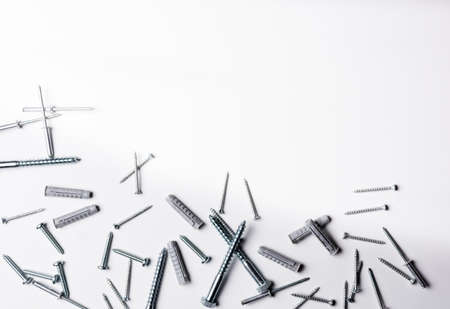 Screws and plugs of different kinds on a white background with copy space.の写真素材