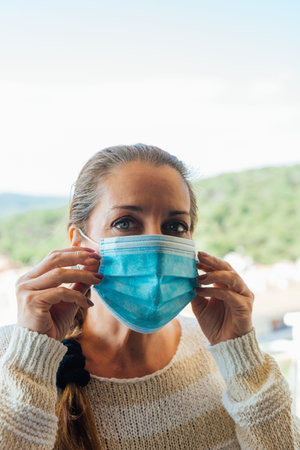 Woman on the street with a mask of protection against diseases or viruses such as covid19の写真素材