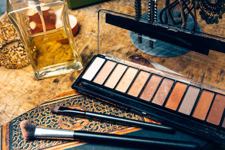 Make-up products for women on a table accompanied by different accessoriesの写真素材