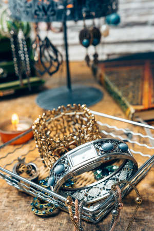 Desk full of accessories for women. We find makeup, smart phones, agenda, jewelry and sunglassesの写真素材