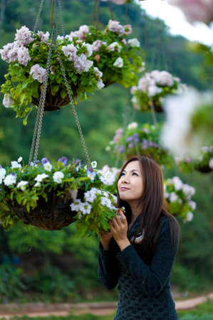 Beautiful south asian girl and flowersの写真素材