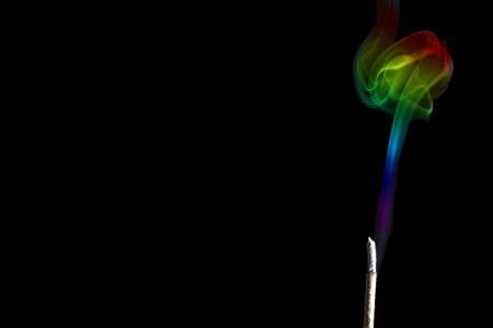 Colorful Rainbow Smoke Isolated on Black backgroundの写真素材