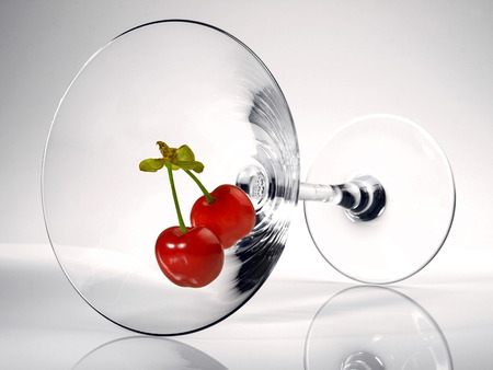 Cherrys in a Cocktail Glass on white Backgroundの写真素材