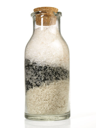 Stone and Sea Salt in a Bottle on white background